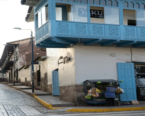 Woman walking carrying groceries in a local Peruvian market